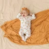 1-Firefly_Gemini Flash_change the green sheet and the bow on the baby's head to this color code muted orange 351425